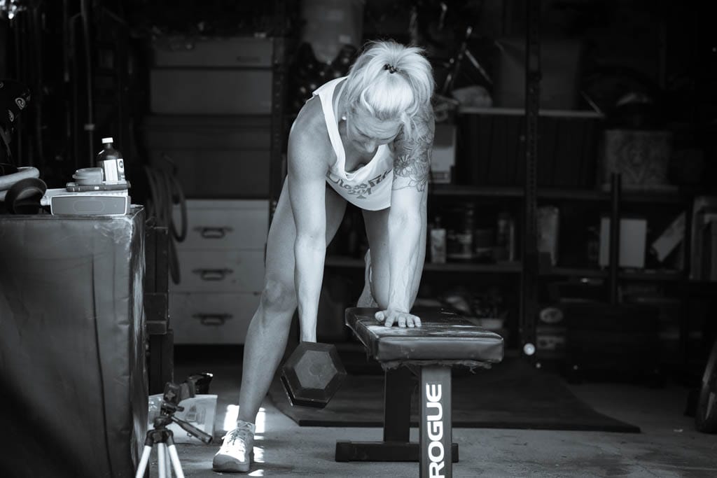 At-home 30-minute workouts: dumbbell rows in the garage.