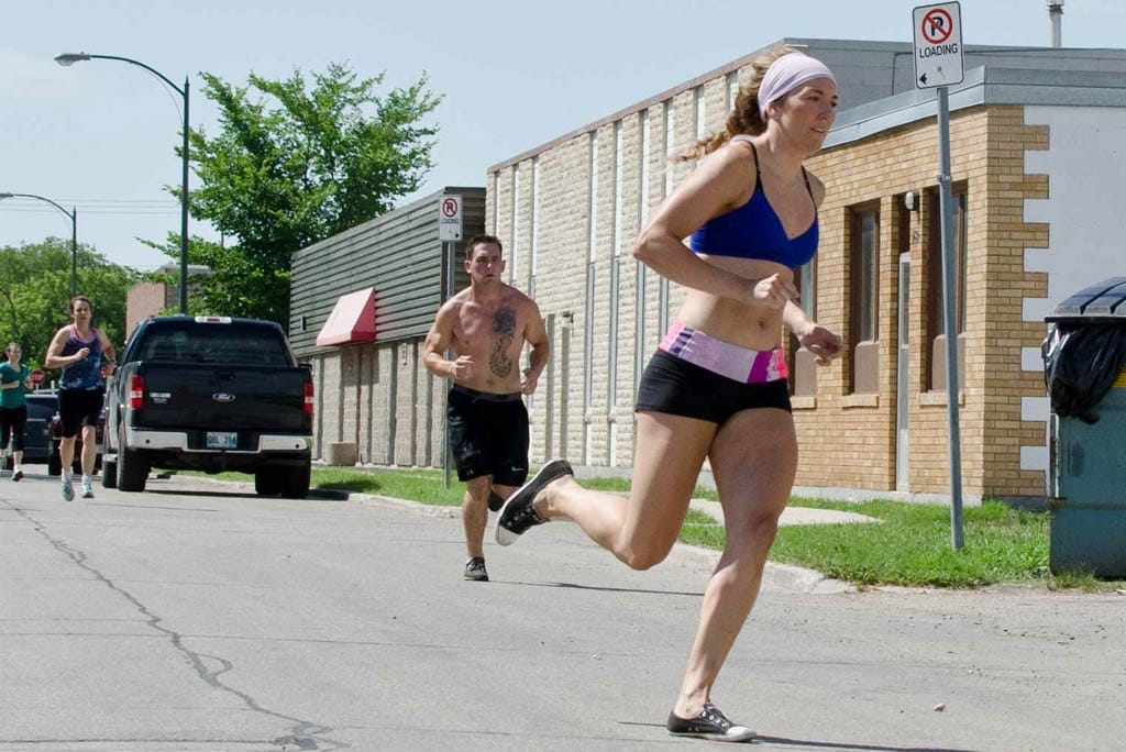 Crystal Kirby-Peloquin runs along Berry Street in Winnipeg.